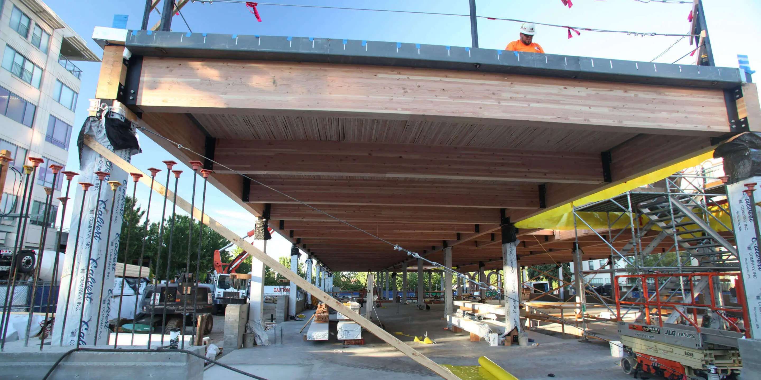 Construction of mass timber structure with laminated beams.